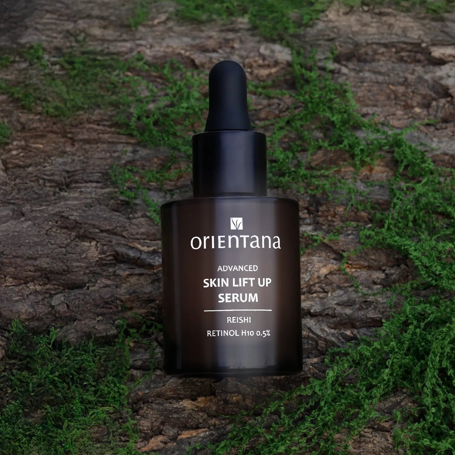 Serum z RETINOLEM H10 0,5% i REISHI 30 ml - Orientana Skin lift up serum na tle drzewa